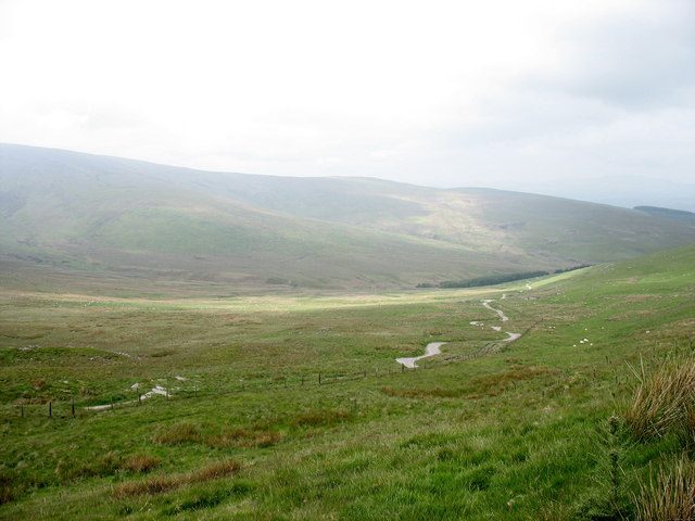 The old track across the Berwyn mountains from Llandrillo to Llanarmon Dyffryn Ceiriog, running across a wide green moorland valley