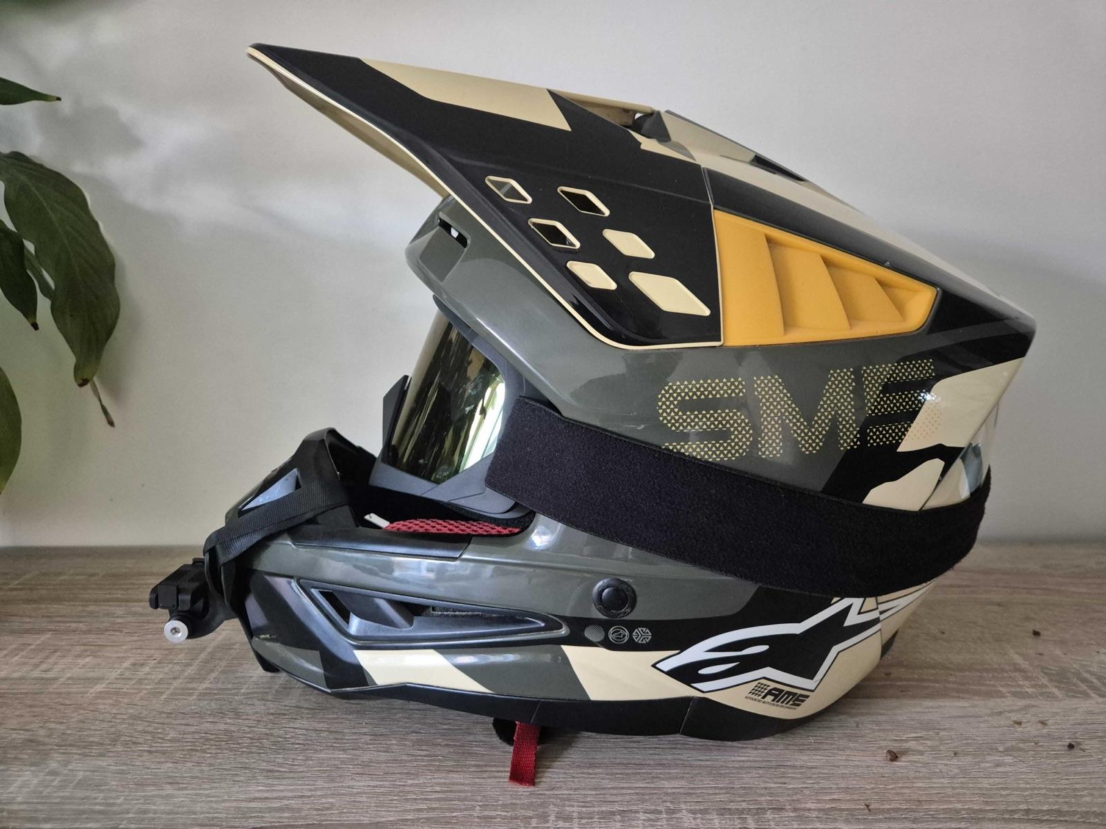 Alpinestars SM5 motocross helmet in sand and olive camo, side view with goggles fitted