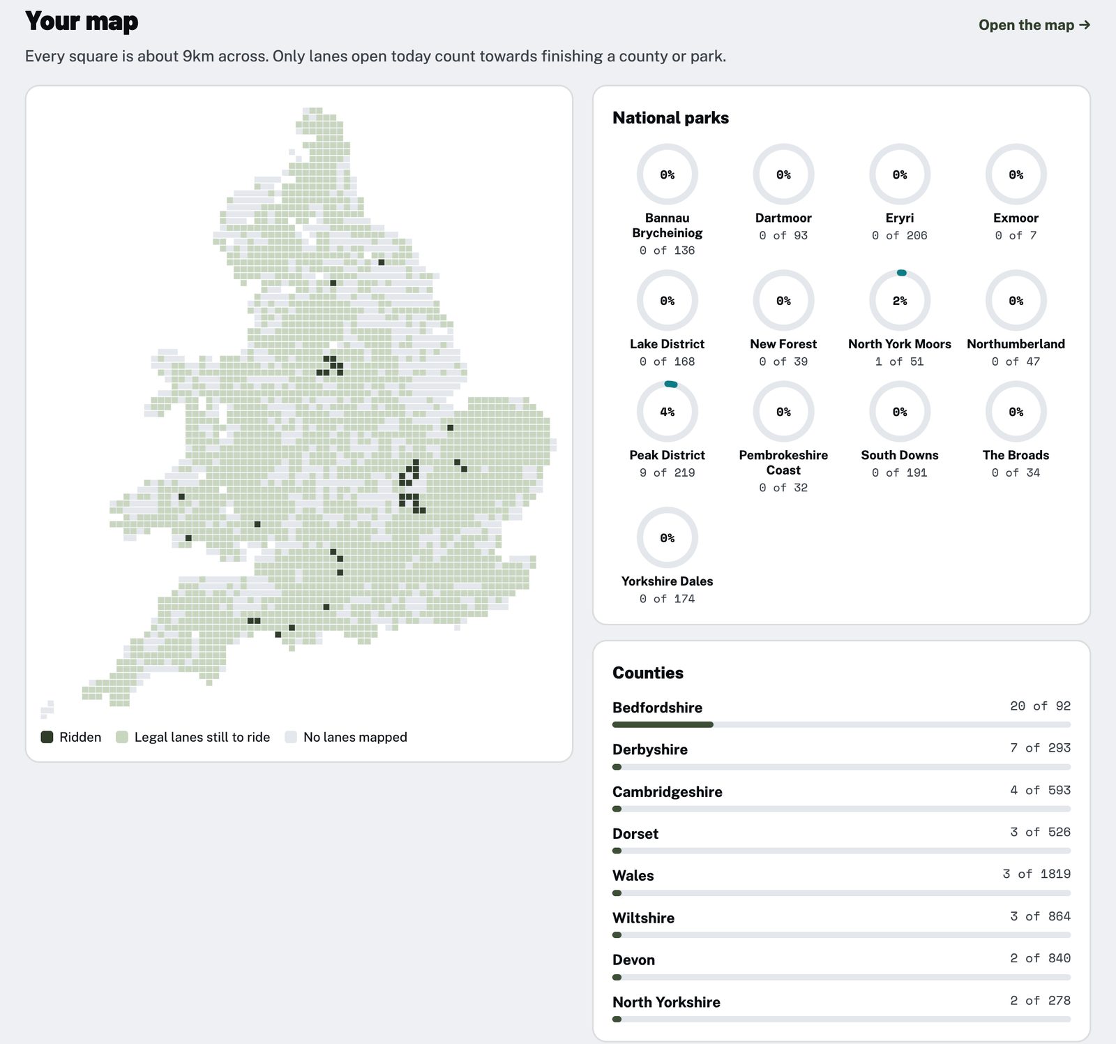 A Holloway completion map of England and Wales in squares, with ridden squares shaded dark, next to progress rings for each national park and progress bars for each county