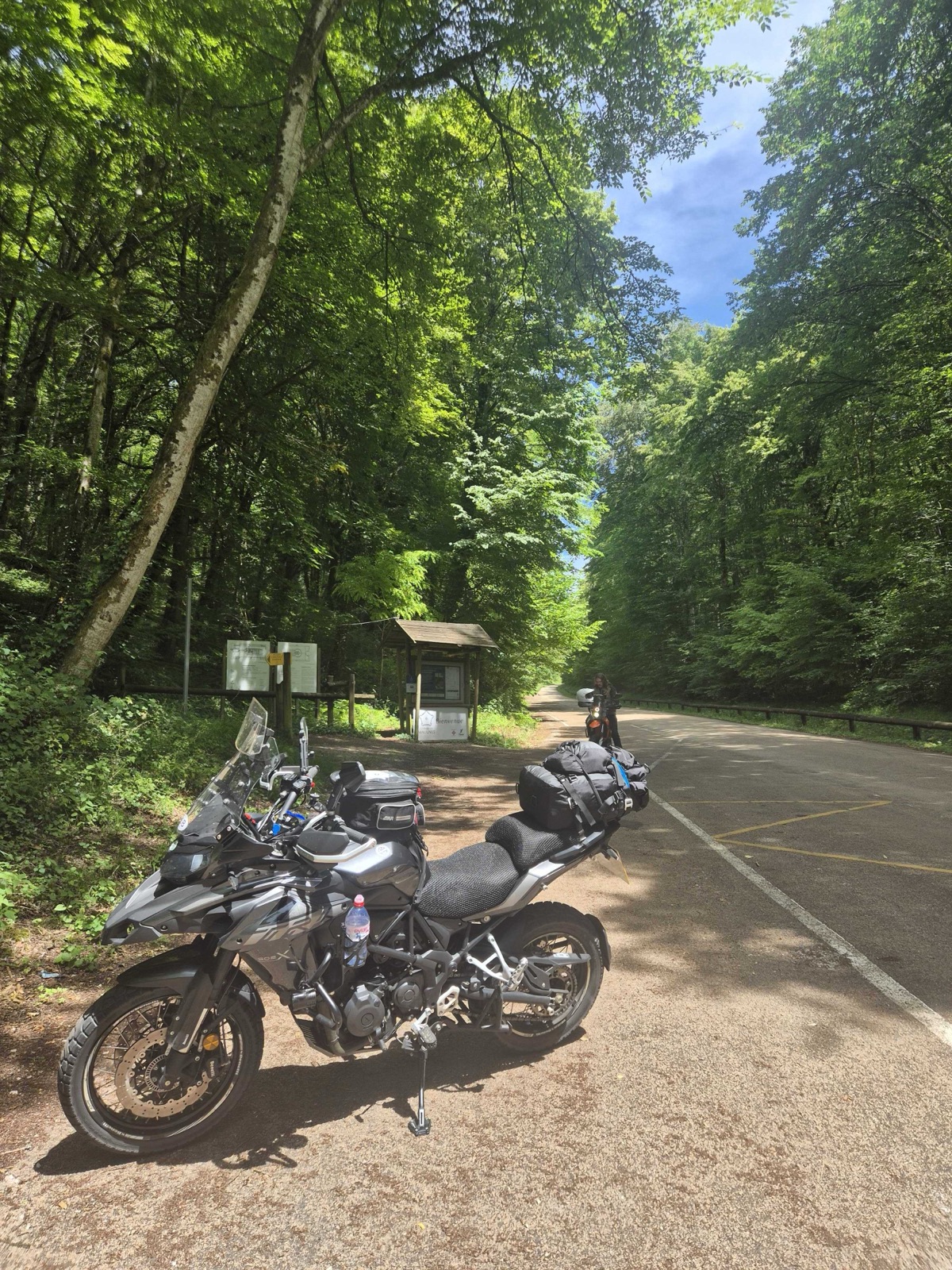Benelli TRK 502 X on a paved forest road in France, roughly the limit of what it was actually asked to do off the beaten path
