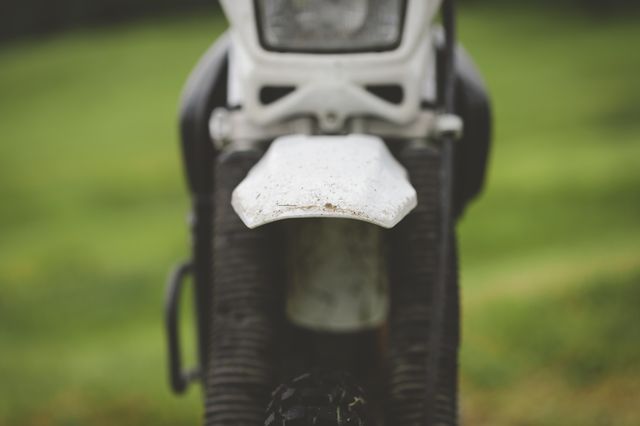 A close-up of a motorcycle's front mudguard and radiator area