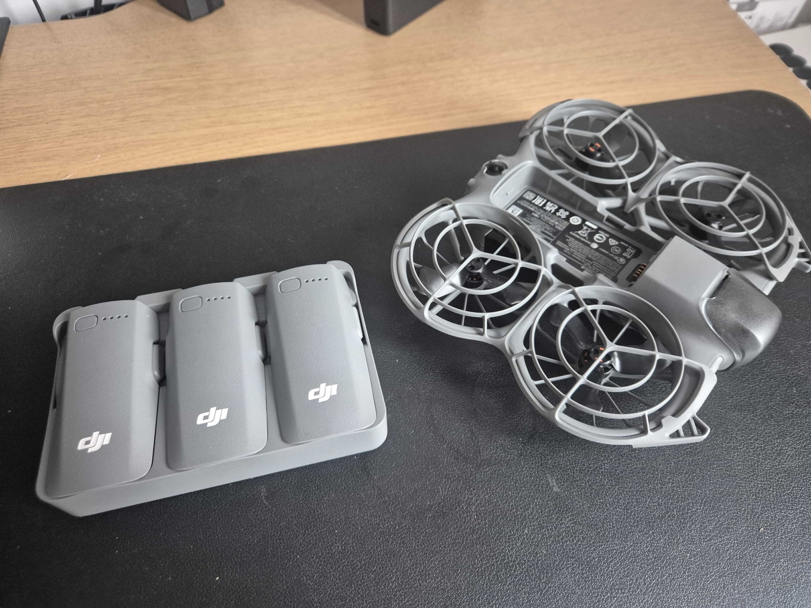 DJI Neo 2 Fly More combo, drone and three-battery charging hub with real DJI batteries