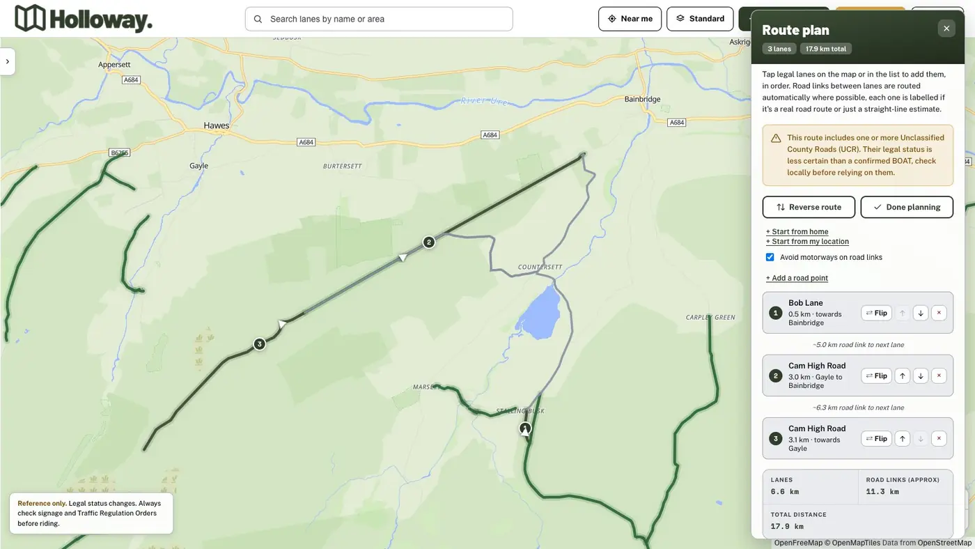 The Holloway green lane route planner showing a route on Cam High Road near Hawes with direction arrows and the new Reverse route button