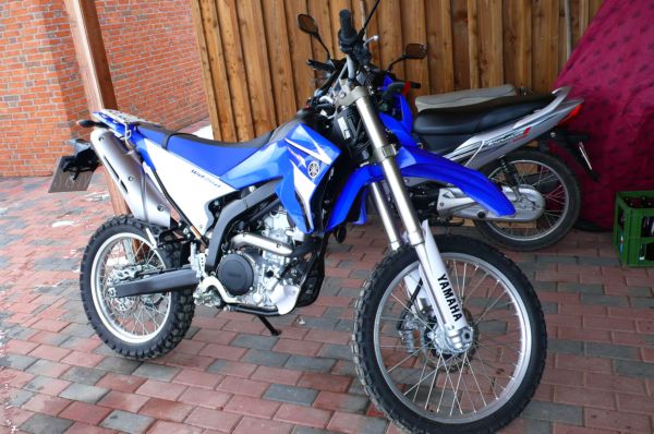 A trail bike parked and ready before a ride