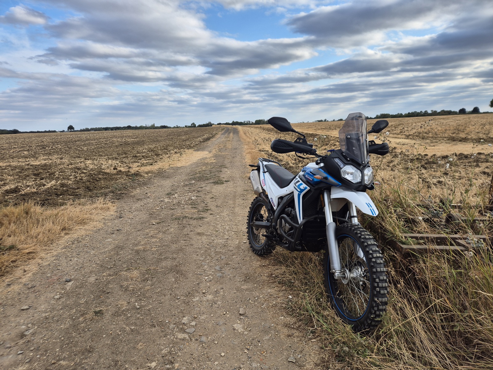 Voge 300 Rally parked on a dirt farm track