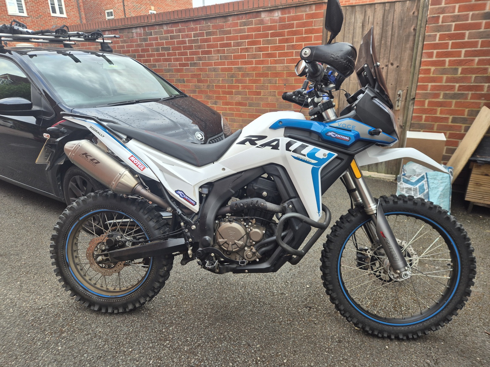 Voge 300 Rally side profile showing the single-cylinder engine and stainless exhaust