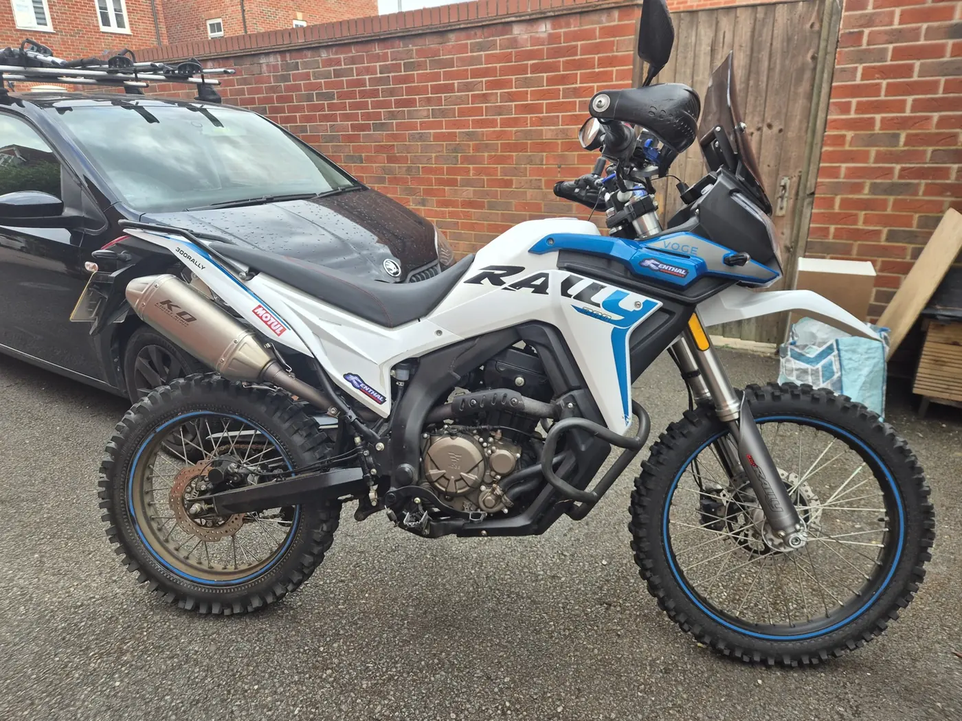 Voge 300 Rally side profile showing the single-cylinder engine and stainless exhaust